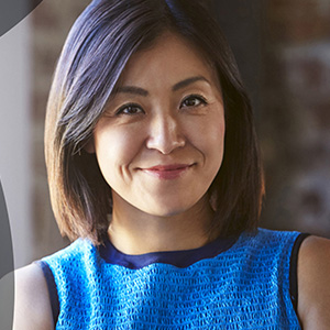 Businesswoman wearing a blue top.