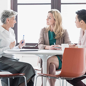 3 business people meeting in a conference room
