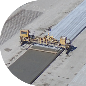 Birdseye view of Ideker equipment paving a new road
